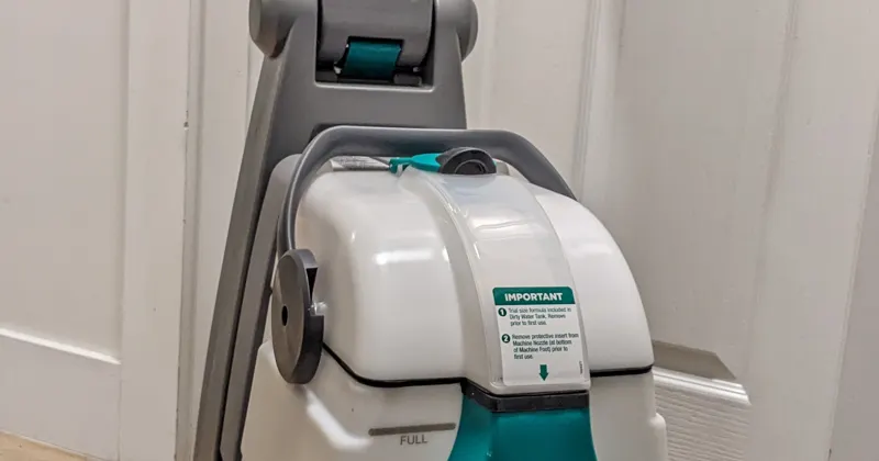 Bissell Big Green carpet cleaner standing in a hallway